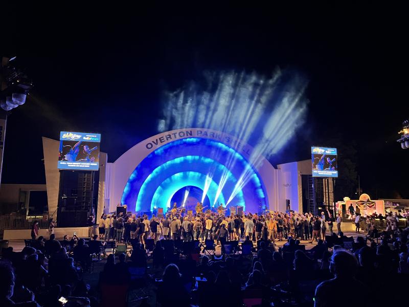 Overton Park Shell during concert lit up with crowd