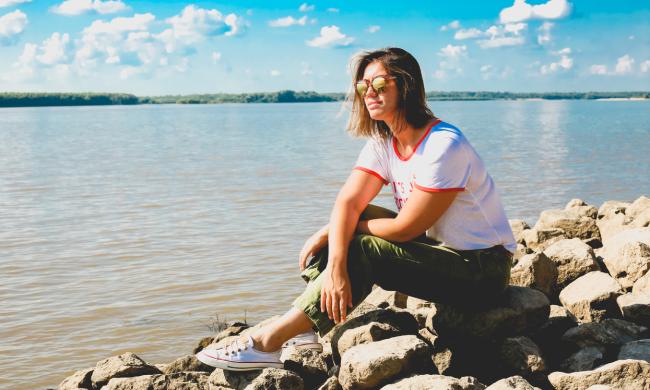 Woman hiker enjoying a lake view at Shelby Forest State Park near Memphis | Alex Shansky