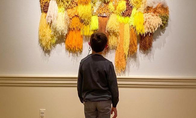 Kid enjoying art at The Dixon