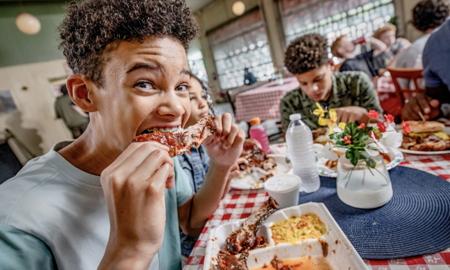 boy eats rib at payne's