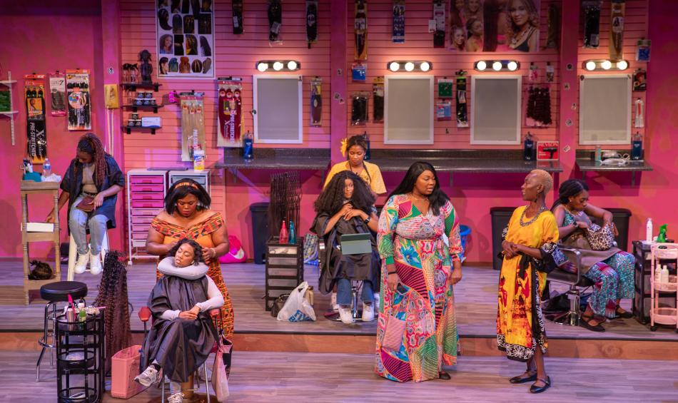 Hattiloo production of "Harlem Hair Salon," showing women at work braiding hair.